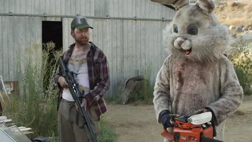Guy with gun and Bunnyman